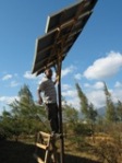 Miraji working on solar panel in Image email